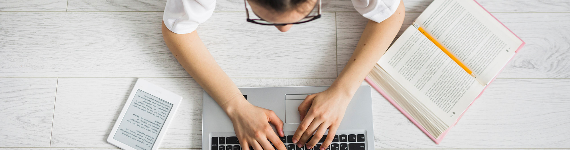 Woman using a laptop. Knowledge based services in technology, law, business and linguistics 